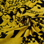 Tissu jersey de coton motif scène de crime collection "Random" - Ocre et noir - Les Filles à Pois ® - Oeko-Tex ® Les Filles à Po